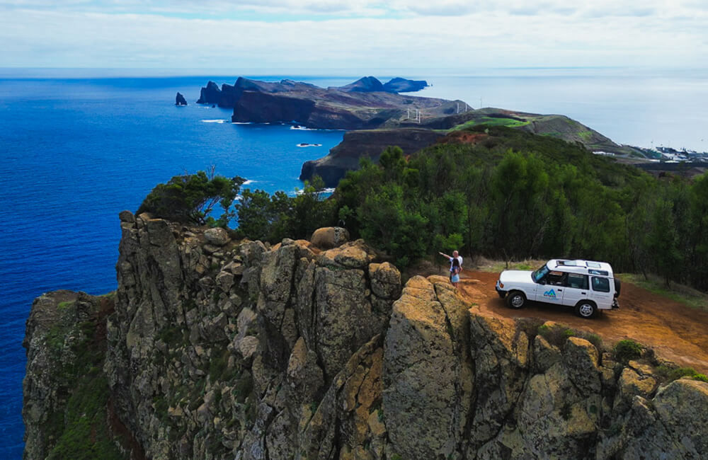 Coast view with small villages and ocean, blue sky in the midday sun
