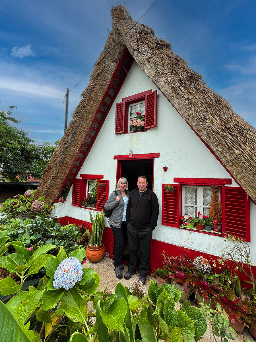 An old tradidional madeira house in Santana with natural roof and small fence